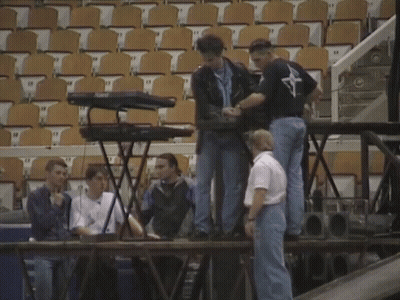 Man In Brooklyn Shirt Typing On Keyboard GIF