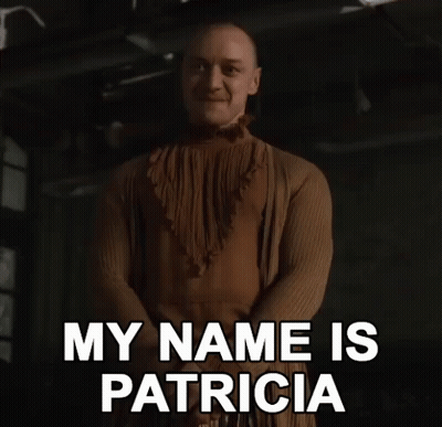Man In Brown Dress Saying My Name Is Patricia GIF