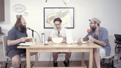 Man In Brown Jacket And Tie With Scoop On A New One Sign GIF