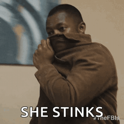 Man In Brown Jacket Covering Face GIF