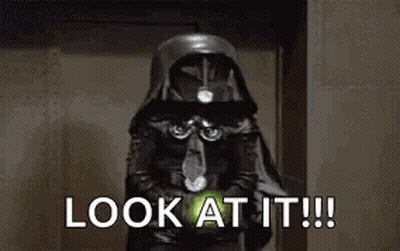 Man In Brown Jacket Holding Lightsaber Saying Look At It GIF