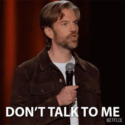 Man In Brown Jacket Holding Microphone Says Don't Talk To Me GIF