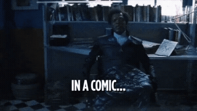 Man In Brown Jacket In Front Of Bookshelf GIF