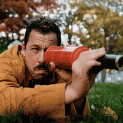 Man In Brown Jacket Looking Through Red UCSD Object GIF