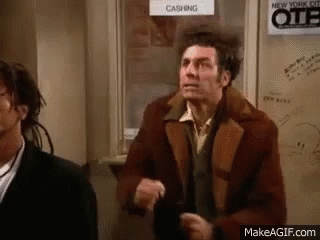 Man In Brown Jacket Next To Man In Black Suit GIF