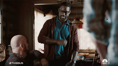 Man In Brown Jacket Next To Man In Blue Shirt GIF