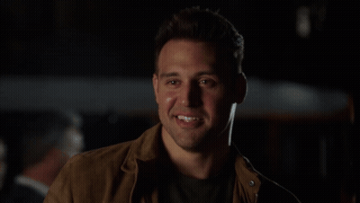 Man In Brown Jacket Smiling GIF
