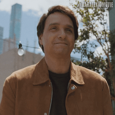 Man In Brown Jacket Smiling #Karatekidmovie GIF
