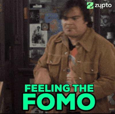 Man In Brown Jacket Standing Before Feeling FOMO Sign GIF