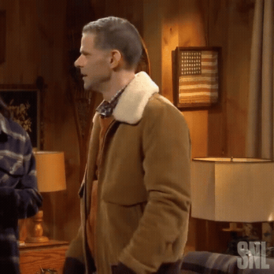 Man In Brown Jacket With American Flag GIF