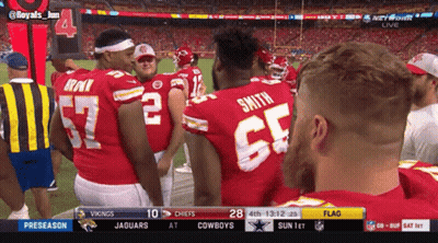 Man In Brown Jacket With Bob On His Back GIF