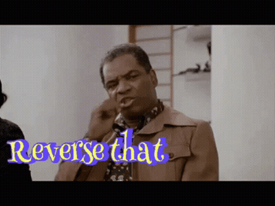 Man In Brown Jacket With Reverse That Sign GIF
