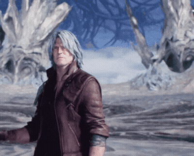 Man In Brown Leather Jacket Standing Before Large Tree GIF