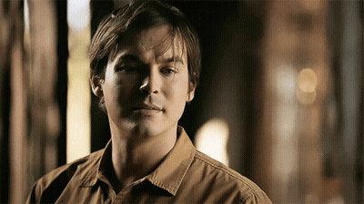Man In Brown Shirt Close Up GIF