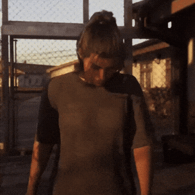 Man In Brown Shirt In Front Of Fence And Fox Building GIF