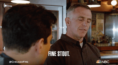 Man In Brown Shirt Saying Fine Stout To Another GIF