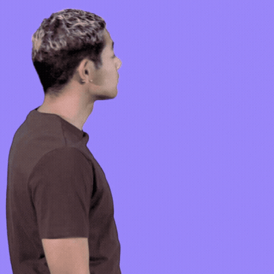 Man In Brown Shirt Waving In Front Of Oh H Sign GIF