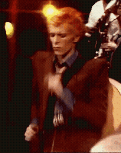 Man In Brown Suit And Blue Shirt Dancing GIF