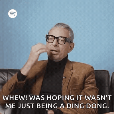 Man In Brown Suit Talking GIF
