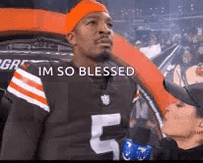 Man In Browns Jersey Interviewed By Woman In Crowd GIF