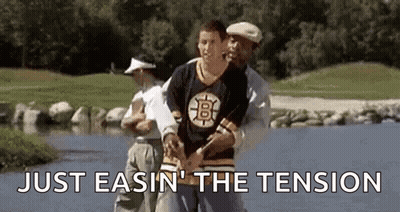 Man In Bruins Jersey Helped By Man In Golf Shirt GIF