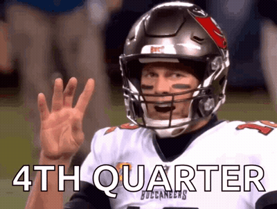 Man in Buccaneers Jersey and Helmet Waving
