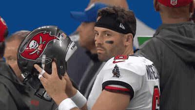 Man In Buccaneers Jersey Holding Helmet GIF