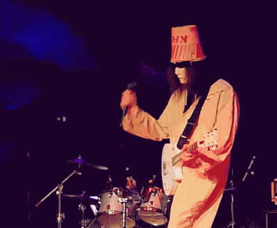 Man In Bucket Hat Playing Guitar On Stage GIF
