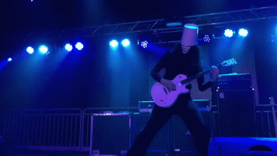 Man In Bucket Hat Playing Guitar On Stage GIF