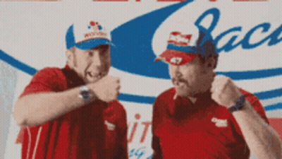 Man In Budweiser Hat Next To Man In Red Shirt GIF