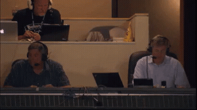 Man In Budweiser Shirt With Headphones At Desk GIF