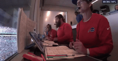Man In Buffalo Bills Jersey Writing With Pen GIF