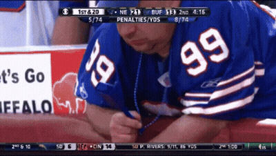 Man In Buffalo Bills Jersey Writing With Pen GIF