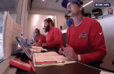 Man In Buffalo Bills Sweatshirt At Desk With Microphone GIF