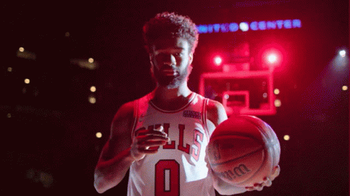 Man In Bulls Jersey Holding Wilson Basketball GIF