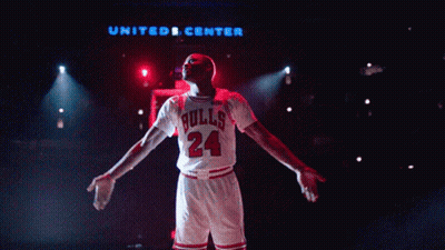 Man In Bulls Jersey In Front Of United Center GIF