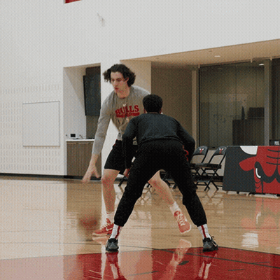 Man In Bulls Shirt Dribbling Ball GIF