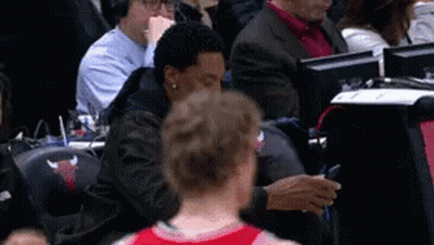 Man In Bulls Shirt Sitting In Stands GIF