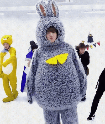 Man In Bunny Costume Next To Group In Costumes GIF