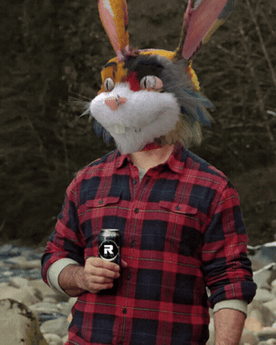 Man In Bunny Mask Holding Can GIF