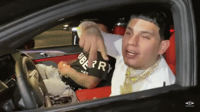 Man In Burberry Shirt Sitting In Black Car GIF