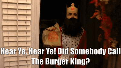 Man In Burger King Costume Holding Food Bag GIF