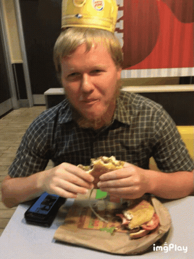Man In Burger King Crown Eating Hamburger GIF