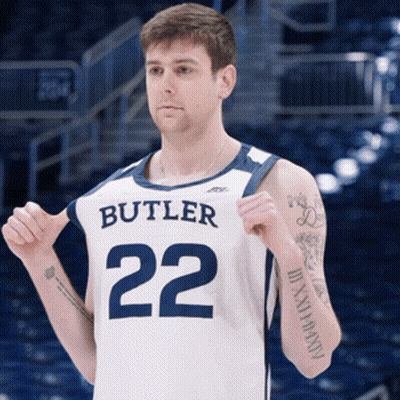 Man In Butler 22 Jersey Holding Shirt Up GIF