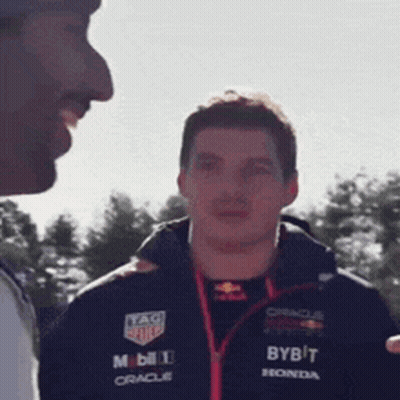 Man In Bybit Jacket Talking To Another Man GIF