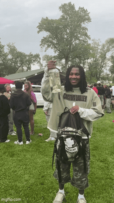 Man In Cactus Valley Shirt Holding Bottle GIF