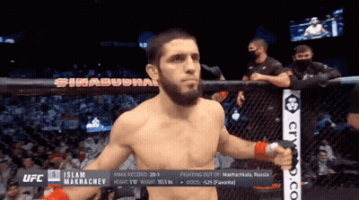 Man In Cage With Islam On Chest GIF