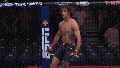 Man In Cage With Sign Saying Serve Your Way GIF