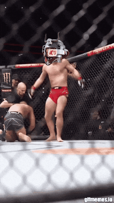 Man In Cage With UFC Helmet GIF