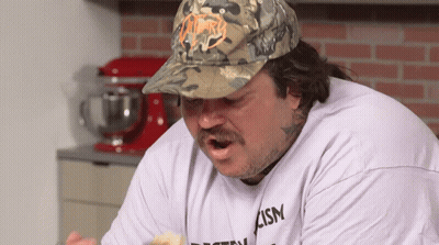 Man In Camo Hat And T-Shirt Saying Ism GIF